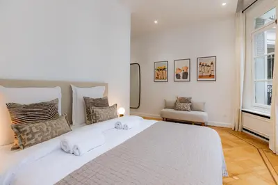 Un ou plusieurs lits dans un hébergement de l'établissement Appartement de prestige climatisé