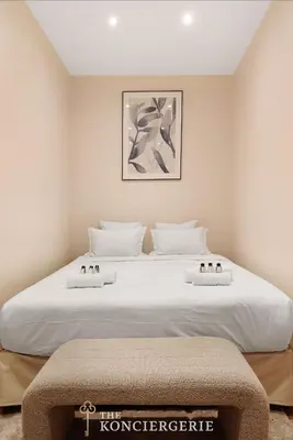 Un ou plusieurs lits dans un hébergement de l'établissement Appartement dException avec Home Cinema Prive