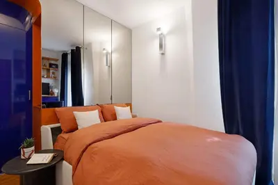 Un ou plusieurs lits dans un hébergement de l'établissement Studio elegant pres de Montmartre et Sacre-Coeur