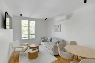 Coin salon dans l'établissement New, air-conditioned apartment - close to Paris