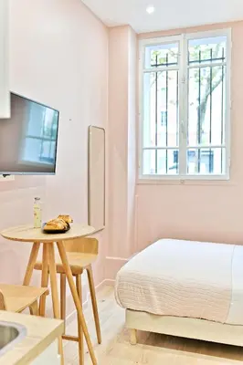 Un ou plusieurs lits dans un hébergement de l'établissement Central, cozy and air-conditioned - Paris 17