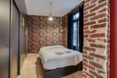 Un ou plusieurs lits dans un hébergement de l'établissement Charming Loft 2p Montmartre Joffrin
