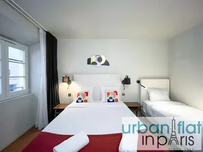 Un ou plusieurs lits dans un hébergement de l'établissement UrbanFlat 132 - Superbe appartement de 4 chambres dans le centre