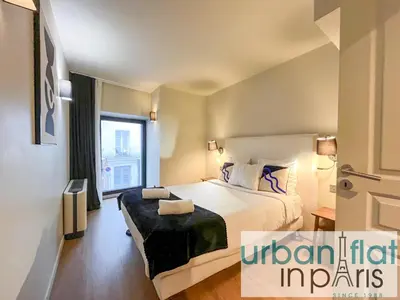 Un ou plusieurs lits dans un hébergement de l'établissement UrbanFlat 132 - Superbe appartement de 4 chambres dans le centre
