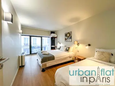 Un ou plusieurs lits dans un hébergement de l'établissement UrbanFlat 132 - Superbe appartement de 4 chambres dans le centre