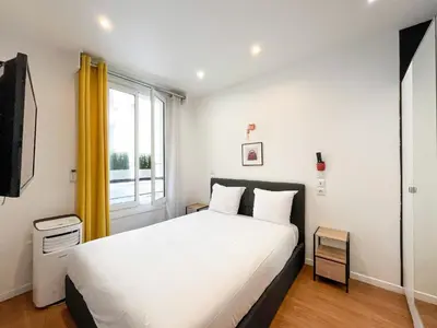 Un ou plusieurs lits dans un hébergement de l'établissement UrbanFlat 115 - Grand Duplex dans le centre de Paris