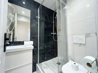 Salle de bains dans l'établissement Urban Flat 105 - Haussmann Opera 4 bedrooms apartment