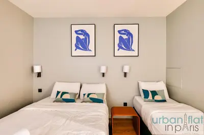Un ou plusieurs lits dans un hébergement de l'établissement UrbanFlat 136 - Duplex de 4 chambres Saint Sebastien