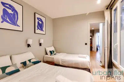 Un ou plusieurs lits dans un hébergement de l'établissement UrbanFlat 136 - Duplex de 4 chambres Saint Sebastien