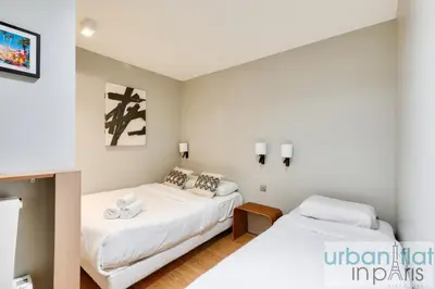 Un ou plusieurs lits dans un hébergement de l'établissement UrbanFlat 136 - Duplex de 4 chambres Saint Sebastien