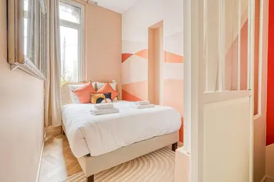 Un ou plusieurs lits dans un hébergement de l'établissement Comfortable 3 rooms with air conditioning