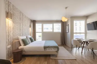 Un ou plusieurs lits dans un hébergement de l'établissement Studio moderne et climatisé - proche Paris