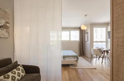 Un ou plusieurs lits dans un hébergement de l'établissement Studio moderne et climatisé - proche Paris