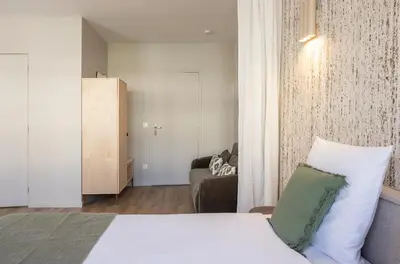 Un ou plusieurs lits dans un hébergement de l'établissement Studio moderne et climatisé - proche Paris