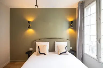 Un ou plusieurs lits dans un hébergement de l'établissement Charming and spacious air-conditioned apartment