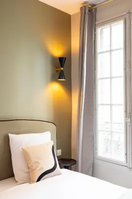 Un ou plusieurs lits dans un hébergement de l'établissement Charming and spacious air-conditioned apartment