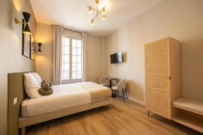 Un ou plusieurs lits dans un hébergement de l'établissement Stylish & Cozy Air-Conditioned Studio