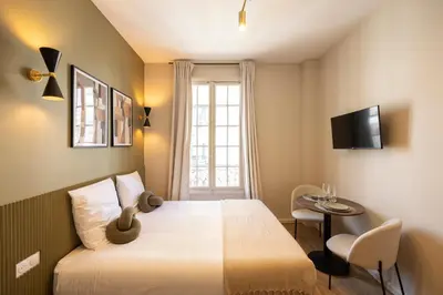 Un ou plusieurs lits dans un hébergement de l'établissement Stylish & Cozy Air-Conditioned Studio
