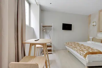 Un ou plusieurs lits dans un hébergement de l'établissement Havre climatisé au cœur de Neuilly