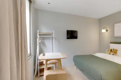 Un ou plusieurs lits dans un hébergement de l'établissement Élégant studio climatisé - Neuilly