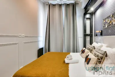 Un ou plusieurs lits dans un hébergement de l'établissement UrbanFlat 44 - Appartement 2 chambres - En pleins centre
