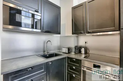 Cuisine ou kitchenette dans l'établissement UrbanFlat 44 - Appartement 2 chambres - En pleins centre