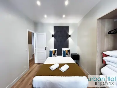 Un ou plusieurs lits dans un hébergement de l'établissement UrbanFlat 23 - Central Flat in Paris Montorgueil