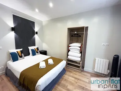 Un ou plusieurs lits dans un hébergement de l'établissement UrbanFlat 23 - Central Flat in Paris Montorgueil