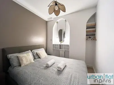 Un ou plusieurs lits dans un hébergement de l'établissement UrbanFlat 178 - Cosy 2 Bedroom in the center of Paris