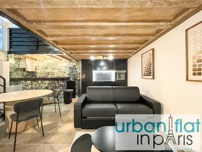Coin salon dans l'établissement UrbanFlat 09 - Stylish Duplex Apartment on Champs-Elysees