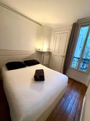 Un ou plusieurs lits dans un hébergement de l'établissement Appartement Peclet Tour Eiffel