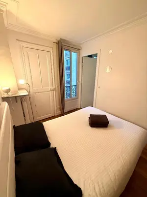Un ou plusieurs lits dans un hébergement de l'établissement Appartement Peclet Tour Eiffel