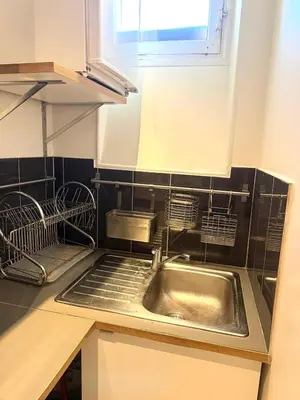 Cuisine ou kitchenette dans l'établissement Appartement Peclet Tour Eiffel