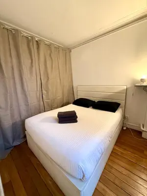 Un ou plusieurs lits dans un hébergement de l'établissement Appartement Peclet Tour Eiffel