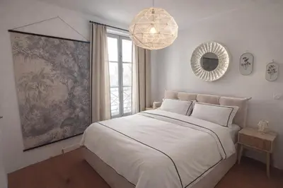 Un ou plusieurs lits dans un hébergement de l'établissement Appartement cosy le marais