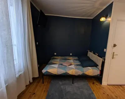 Un ou plusieurs lits dans un hébergement de l'établissement Studio LA ROQUETTE