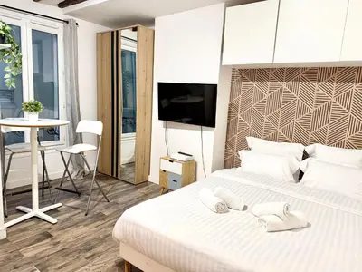 Un ou plusieurs lits dans un hébergement de l'établissement Paris Cozy Flat Bastille & Le Marais et Fibre