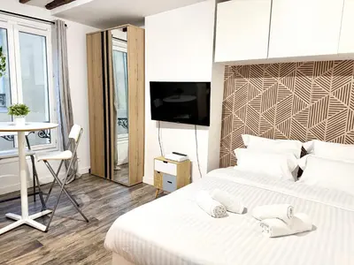 Un ou plusieurs lits dans un hébergement de l'établissement Paris Cozy Flat Bastille & Le Marais et Fibre