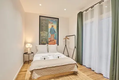 Un ou plusieurs lits dans un hébergement de l'établissement Modern Apartement Center of Paris Montmartre