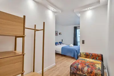Un ou plusieurs lits dans un hébergement de l'établissement UrbanFlat 103 - Grand appartement - Grands Boulevards