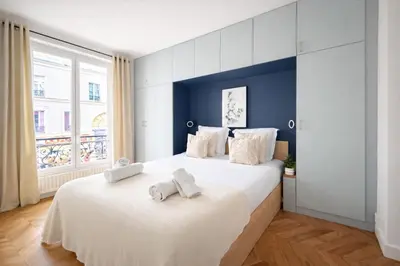 Un ou plusieurs lits dans un hébergement de l'établissement Elegant Appartement au cœur de Montmartre