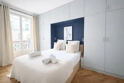 Un ou plusieurs lits dans un hébergement de l'établissement Elegant Appartement au cœur de Montmartre