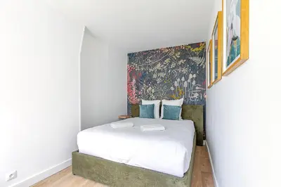 Un ou plusieurs lits dans un hébergement de l'établissement Appartement proche de Paris Près Saint Gervais- IV