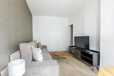 Télévision ou salle de divertissement dans l'établissement Appartement proche de Paris Près Saint Gervais- IV