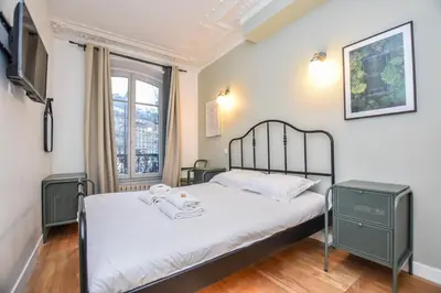 Un ou plusieurs lits dans un hébergement de l'établissement Elegant apartment - 3BR-8P - Gare de l'est