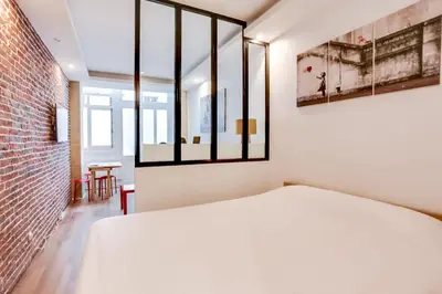 Un ou plusieurs lits dans un hébergement de l'établissement Appartement Chaussee d'Antin - Mogador - Paris 9