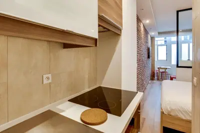 Un ou plusieurs lits dans un hébergement de l'établissement Appartement Chaussee d'Antin - Mogador - Paris 9