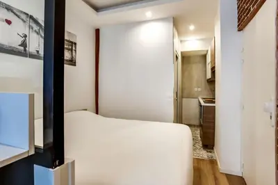 Un ou plusieurs lits dans un hébergement de l'établissement Appartement Chaussee d'Antin - Mogador - Paris 9