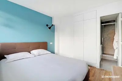 Un ou plusieurs lits dans un hébergement de l'établissement Cozy apartment - 1BR 4P - next to Paris