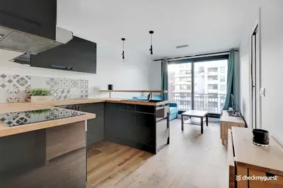 Cuisine ou kitchenette dans l'établissement Cozy apartment - 1BR 4P - next to Paris